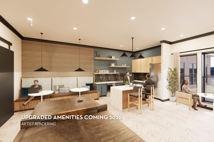 The elegant, newly renovated clubhouse lounge at The Shores apartments, exuding sophistication with a welcoming fireplace, expansive windows providing panoramic views, and luxurious leather seating, offering residents a refined space for relaxation and socializing.